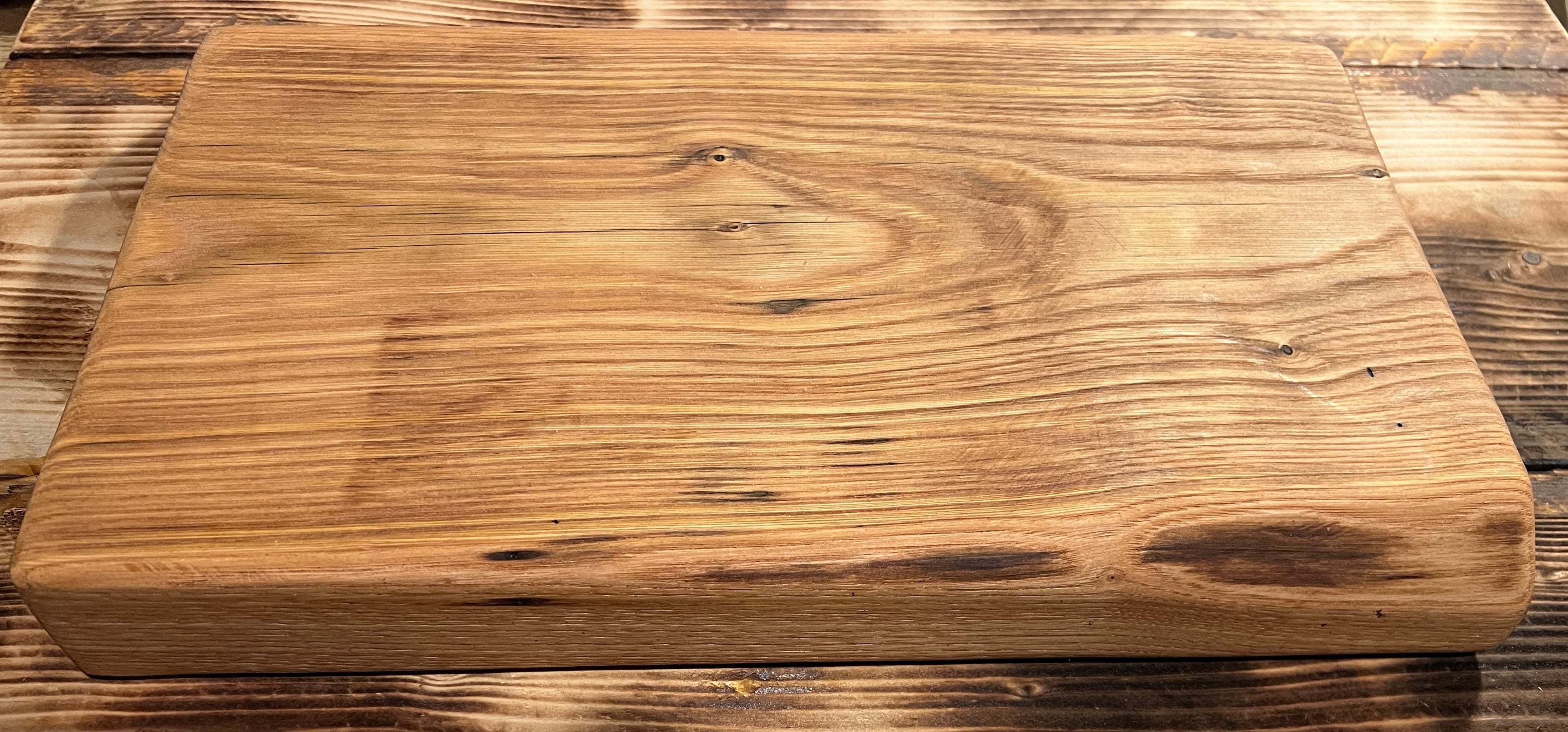 Wooden cutting board on a rustic wooden surface