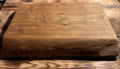 Wooden cutting board on a wooden surface