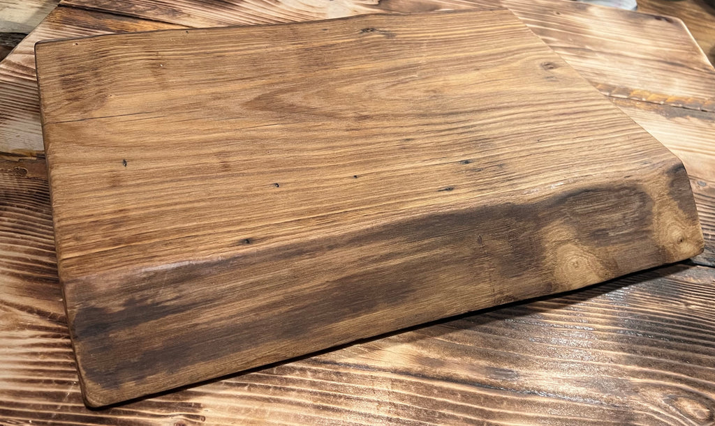 Wooden cutting board on a wooden surface