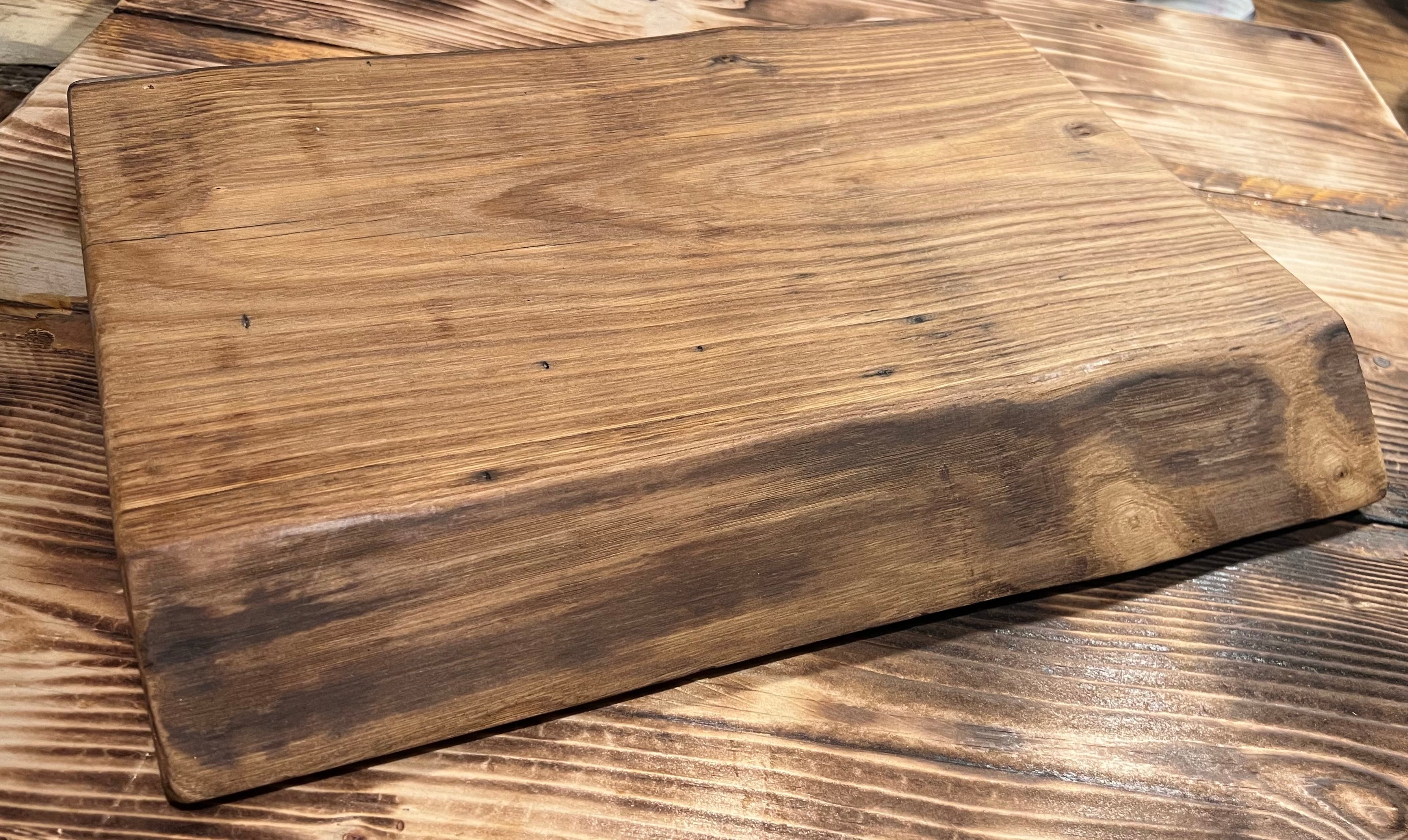 Wooden cutting board on a wooden surface